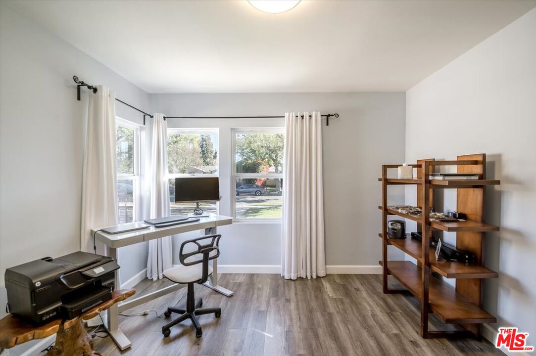5705 Lemona Avenue Sherman Oaks, CA 91411 - Photo 17 of 30 a view of a workspace with furniture and a window