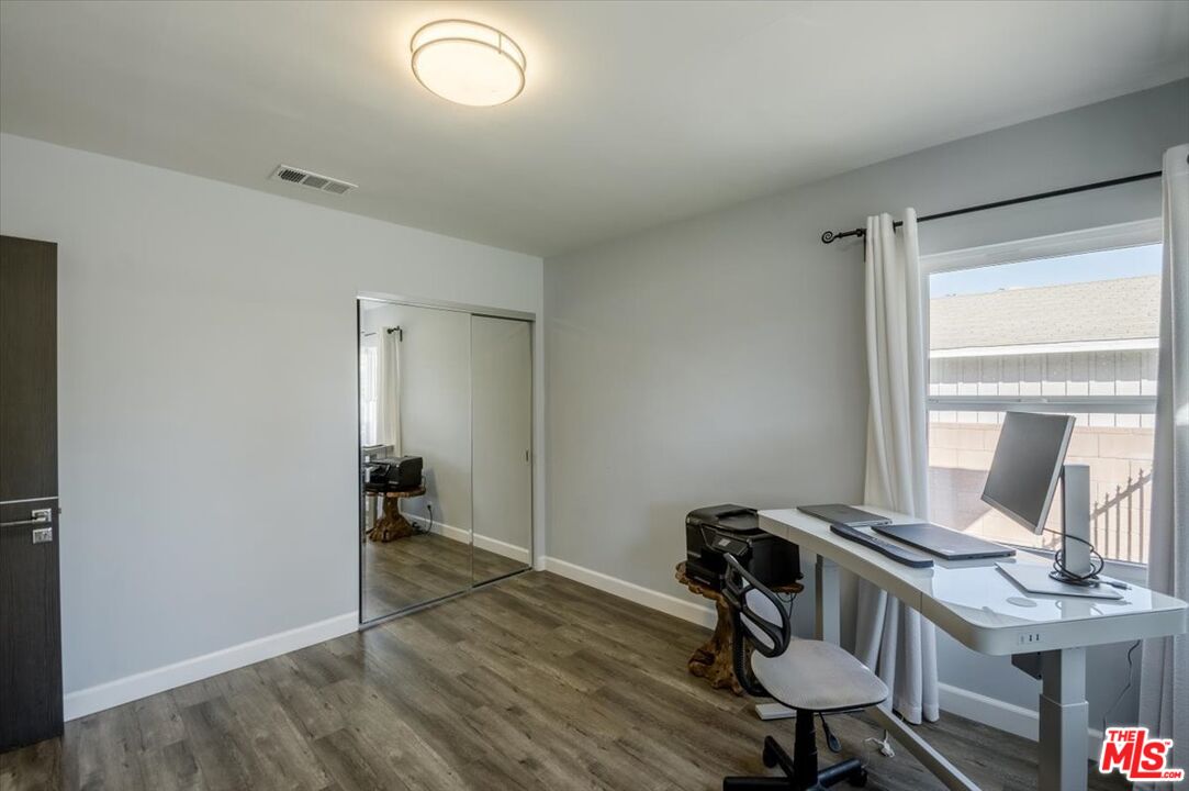 5705 Lemona Avenue Sherman Oaks, CA 91411 - Photo 18 of 30 a view of a workspace with furniture and a window