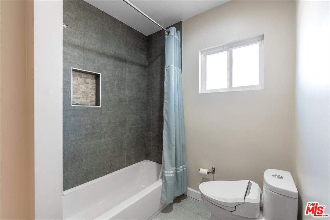 5705 Lemona Avenue Sherman Oaks, CA 91411 - Photo 20 of 30 a bathroom with a toilet and bathtub