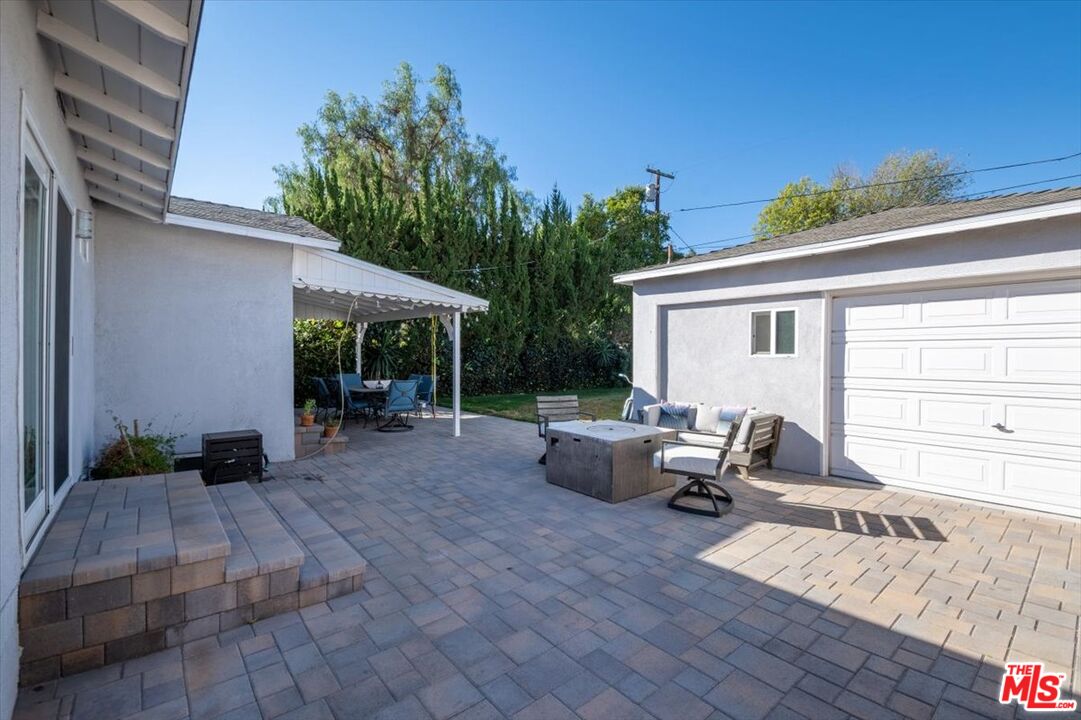 5705 Lemona Avenue Sherman Oaks, CA 91411 - Photo 27 of 30 a view of a house with backyard and sitting area