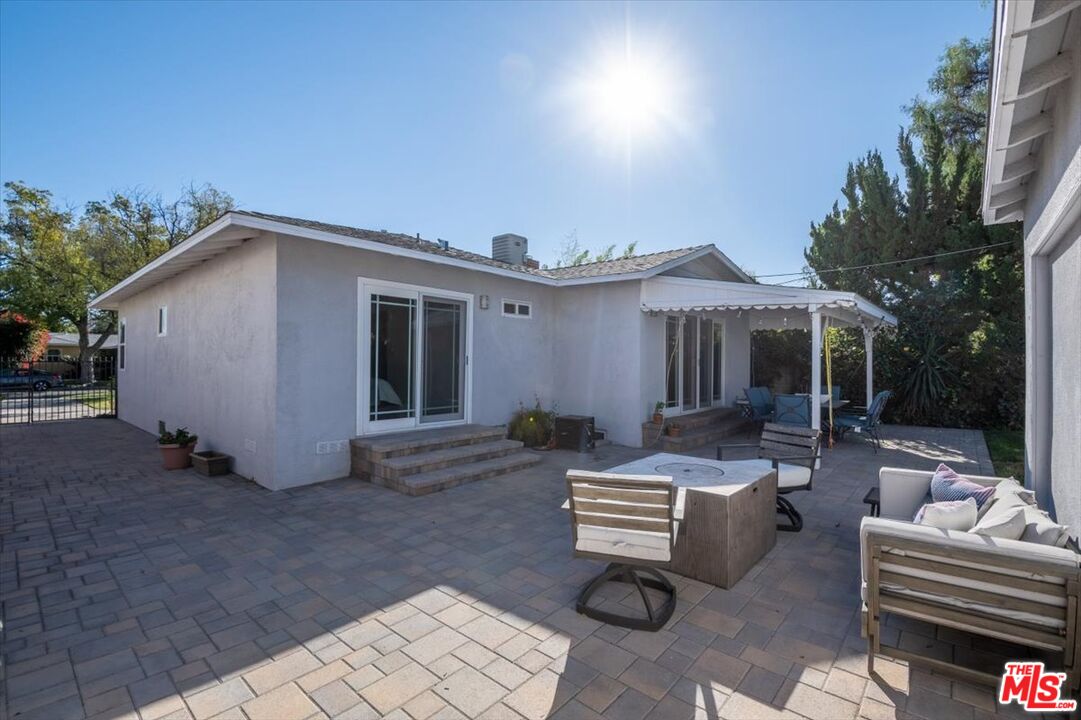 5705 Lemona Avenue Sherman Oaks, CA 91411 - Photo 28 of 30 a view of house with backyard and outdoor seating