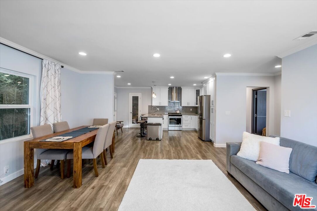 5705 Lemona Avenue Sherman Oaks, CA 91411 - Photo 4 of 30 a living room with furniture and a table