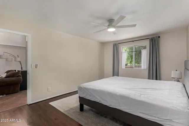 a bedroom with a bed and a window