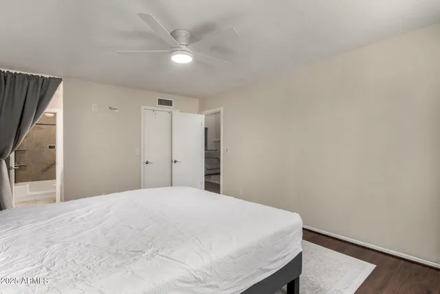 a large white bed in a white room