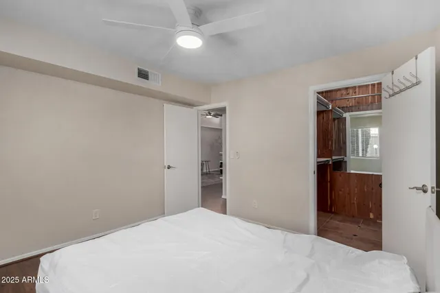 a bedroom with a bed and a bathroom