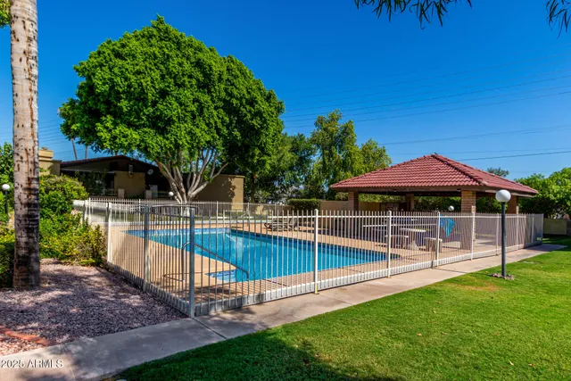 a view of a chair and table in the garden