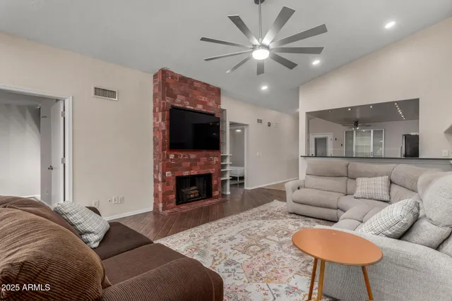 a living room with furniture and a fireplace