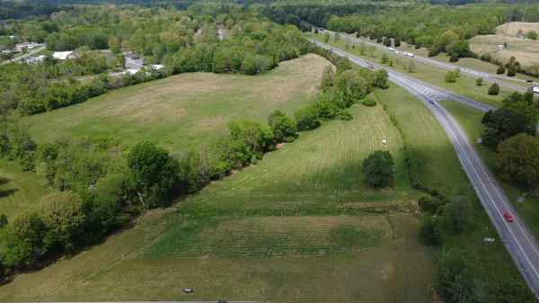 a view of a lake with a yard