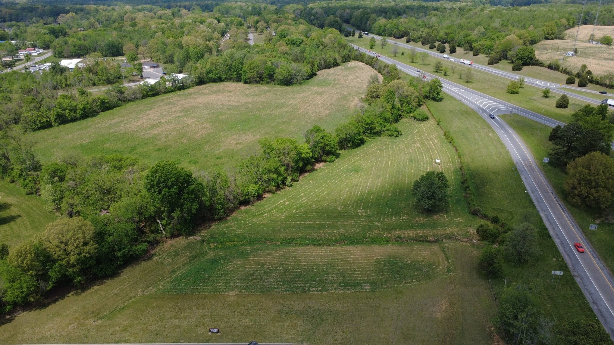 0 Highway 49 West Pleasant View, TN 37146 - Photo 8 of 21 a view of a lake with a yard