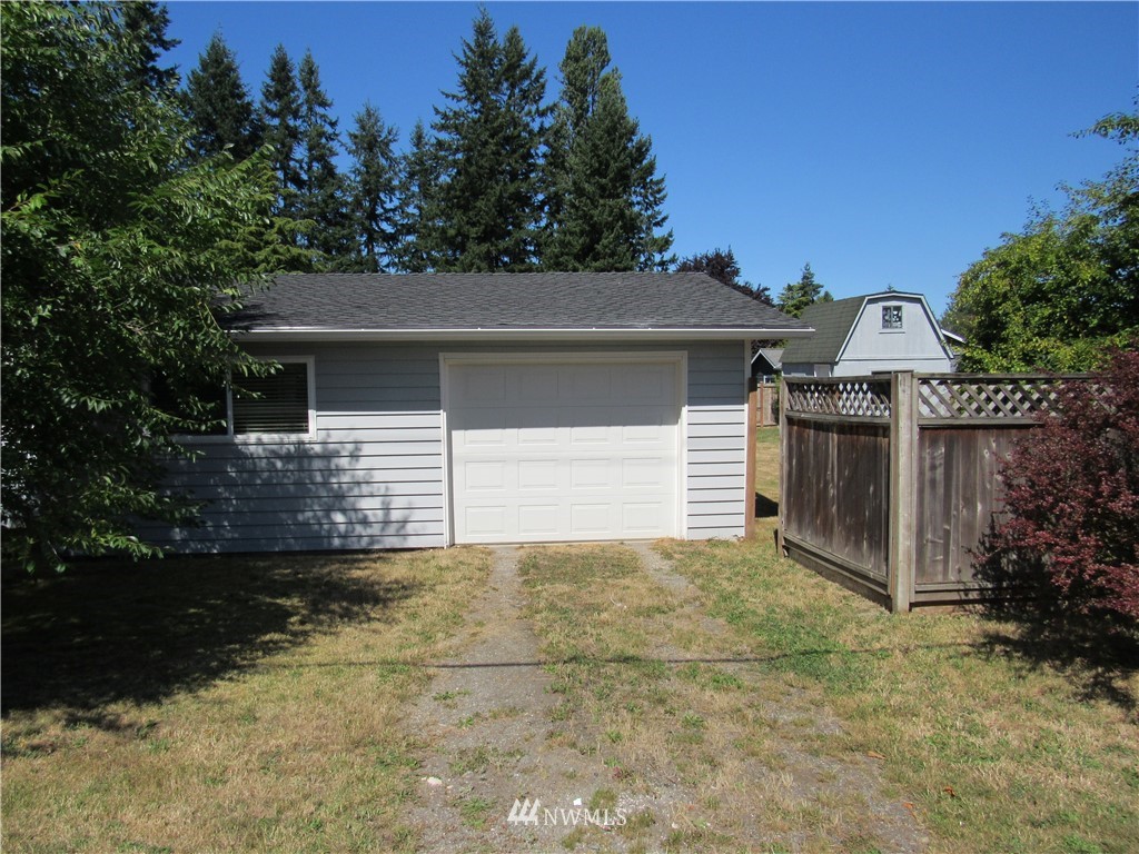 15925 53rd Place West Edmonds, WA 98026 - Photo 2 of 23 a front view of a house with a yard and garage