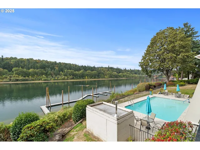 a view of a lake with a house in the background