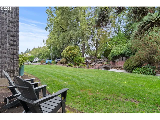 a view of a backyard with sitting area