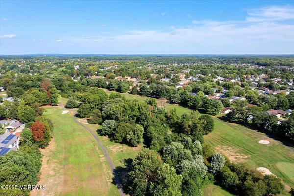 a view of a lake with a yard