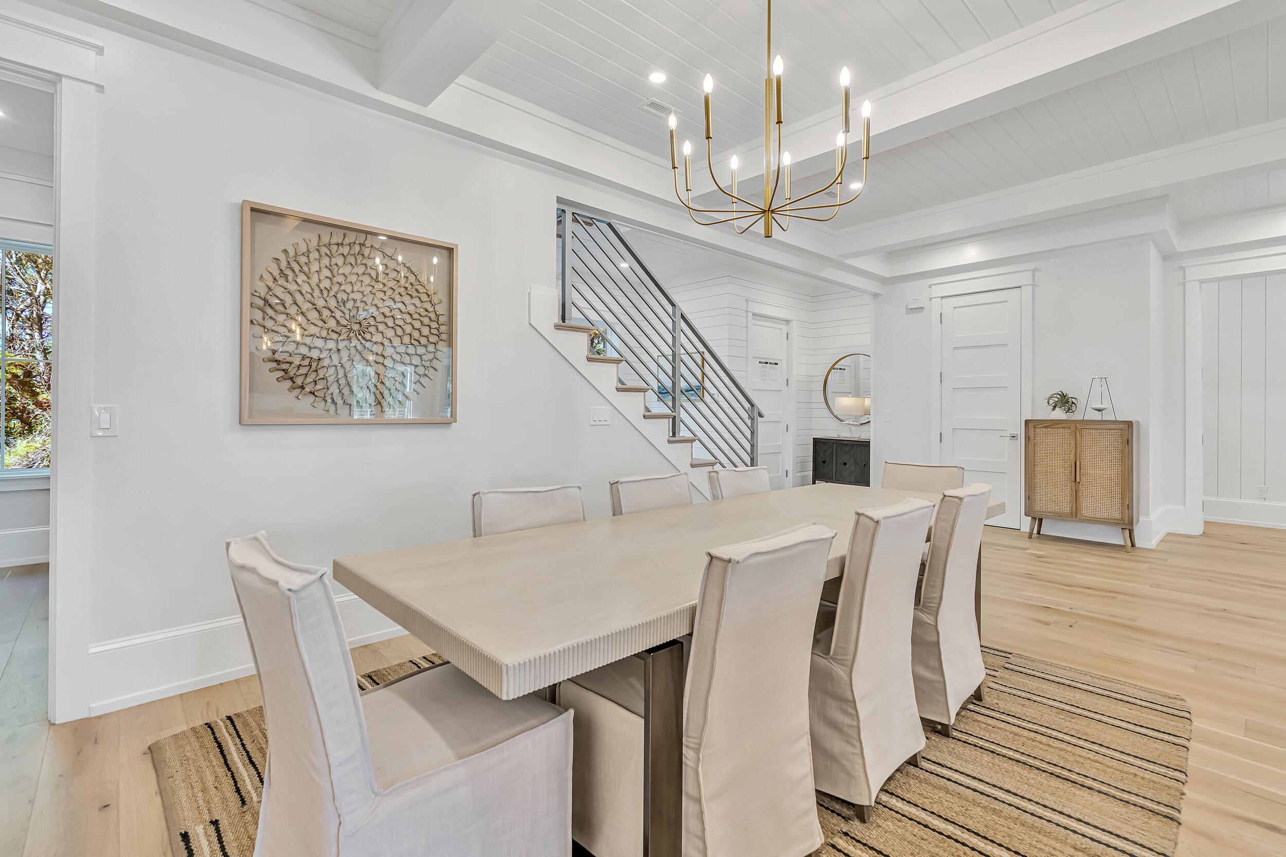 53 Buddy Street Santa Rosa Beach, FL 32459 - Photo 20 of 143 a view of a dining room with furniture and wooden floor