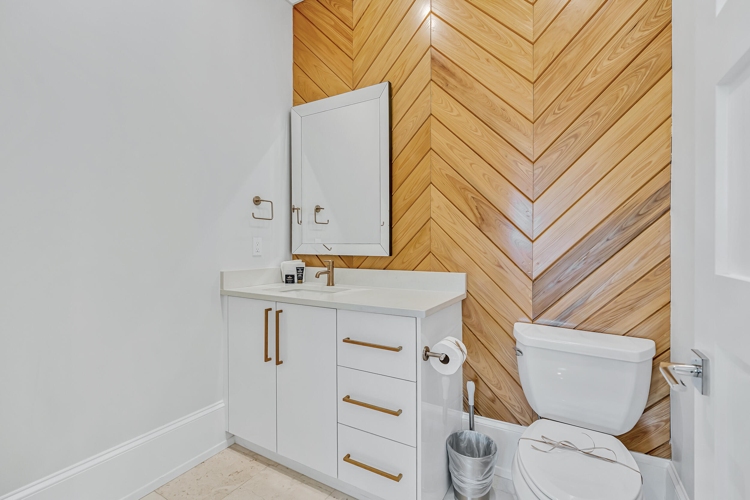 53 Buddy Street Santa Rosa Beach, FL 32459 - Photo 42 of 143 a bathroom with a sink a toilet and vanity