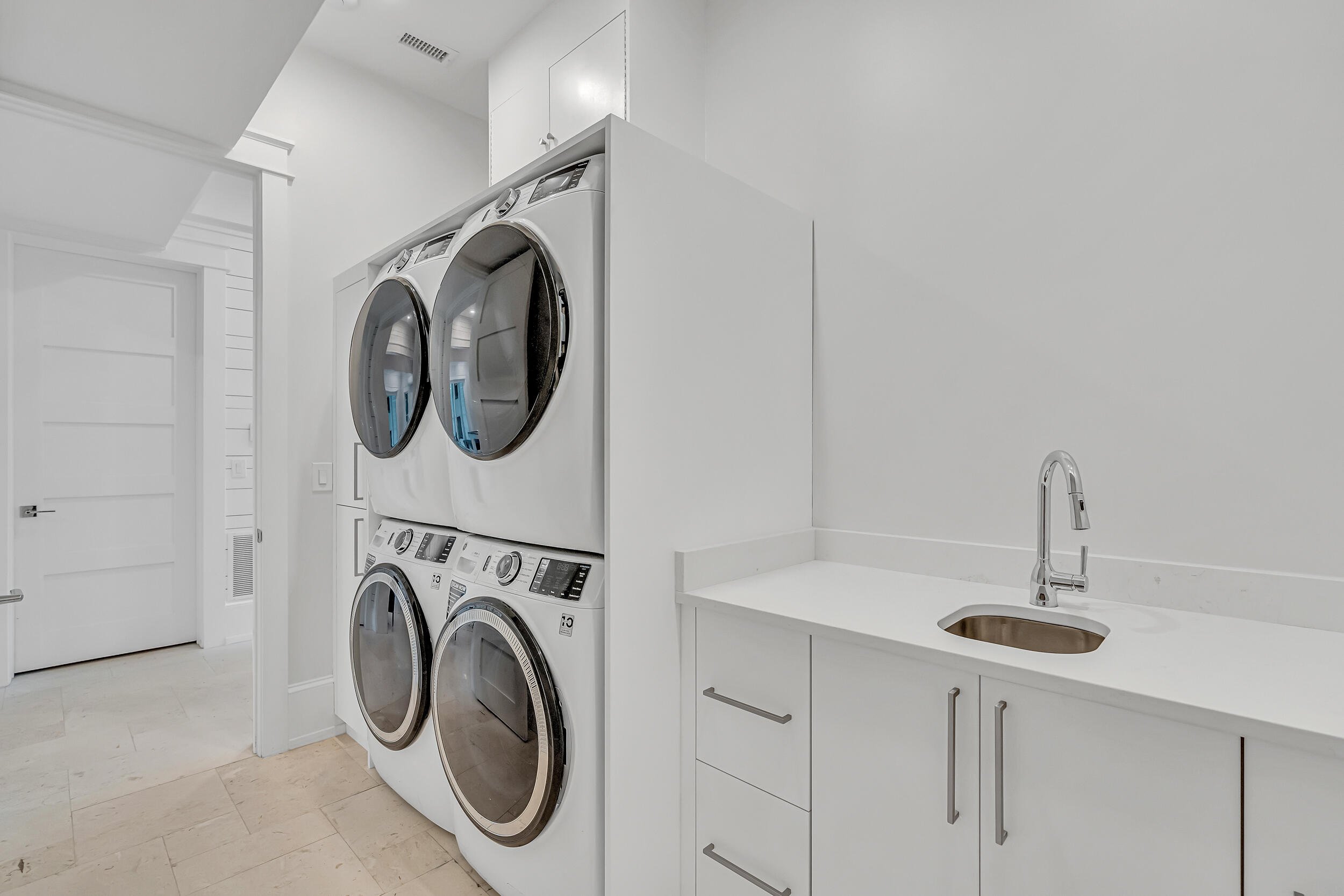53 Buddy Street Santa Rosa Beach, FL 32459 - Photo 50 of 143 a utility room with sink dryer and washer