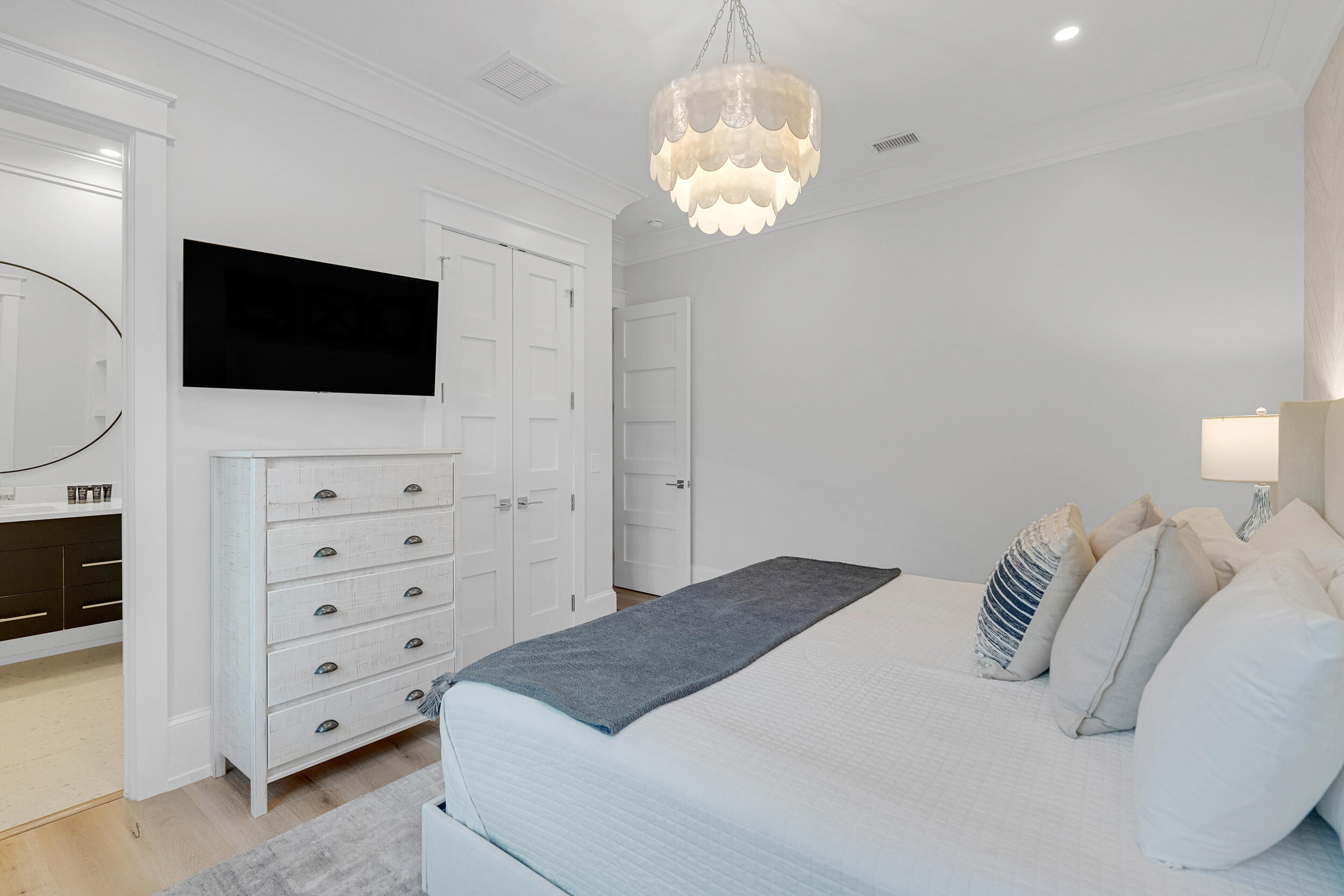 53 Buddy Street Santa Rosa Beach, FL 32459 - Photo 84 of 143 a spacious bedroom with a bed and a flat screen tv
