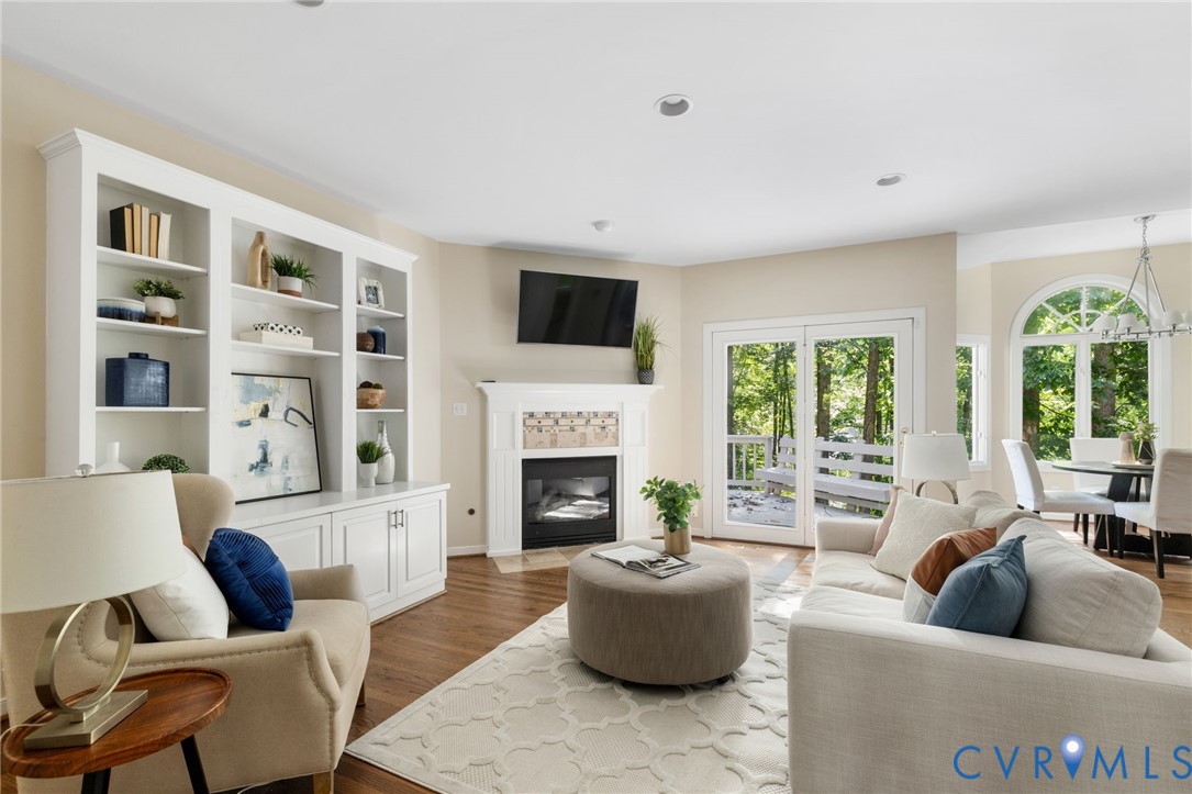 36 Dahlgren Road Richmond, VA 23238 - Photo 12 of 48 a living room with furniture fireplace and a large window