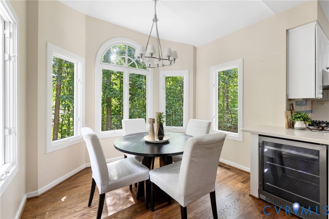 36 Dahlgren Road Richmond, VA 23238 - Photo 15 of 48 a dining room with furniture a chandelier and wooden floor