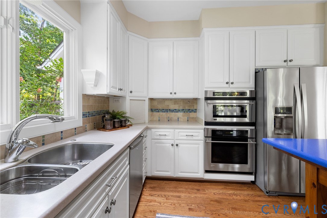 36 Dahlgren Road Richmond, VA 23238 - Photo 20 of 48 a kitchen with a sink cabinets and stainless steel appliances