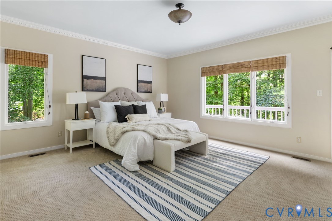 36 Dahlgren Road Richmond, VA 23238 - Photo 24 of 48 a bed sitting in a bedroom next to a window