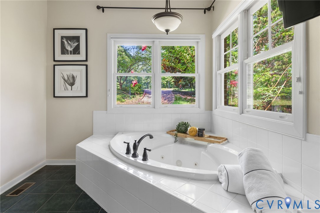 36 Dahlgren Road Richmond, VA 23238 - Photo 28 of 48 a white bath tub sitting next to a window