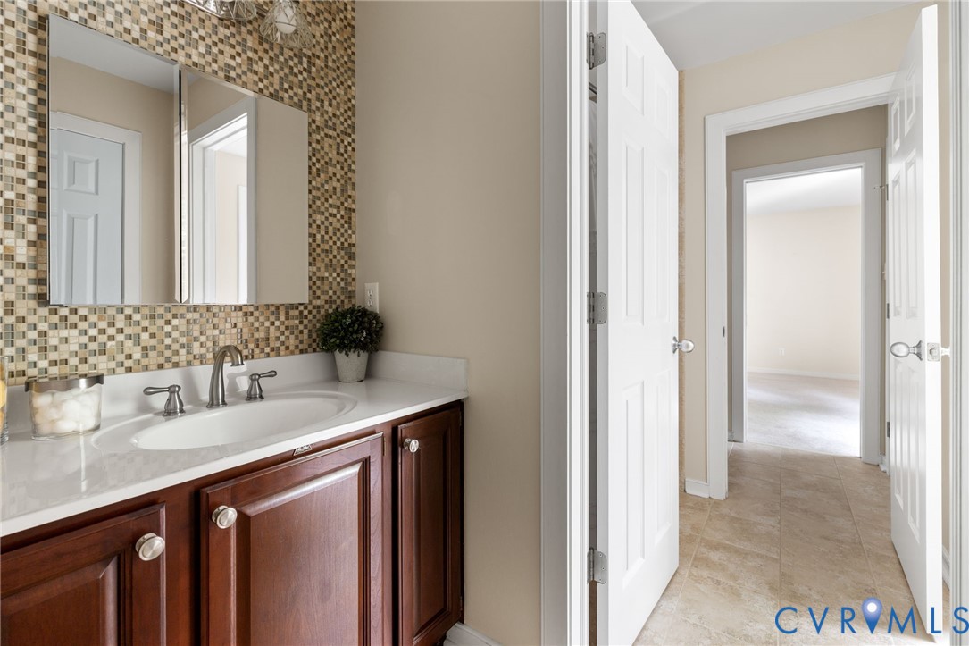 36 Dahlgren Road Richmond, VA 23238 - Photo 34 of 48 a bathroom with a sink and a mirror