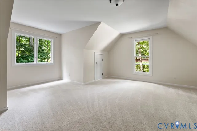 a view of a hallway with paintings on the wall