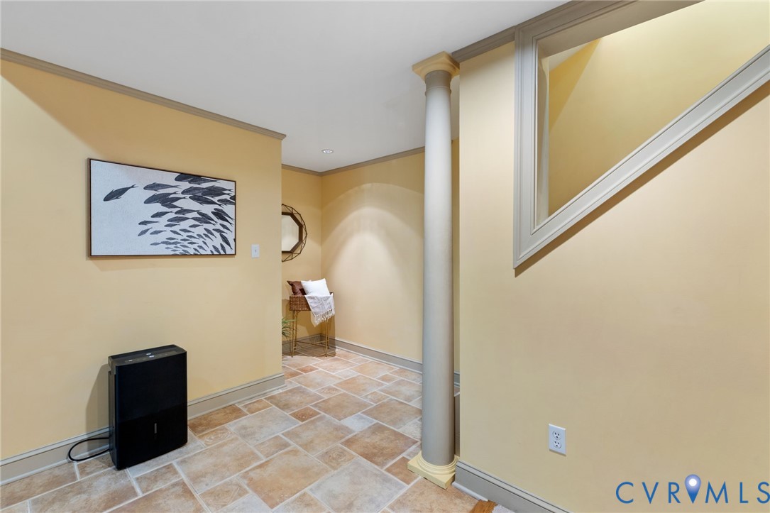 36 Dahlgren Road Richmond, VA 23238 - Photo 36 of 48 a view of a hallway with paintings on the wall