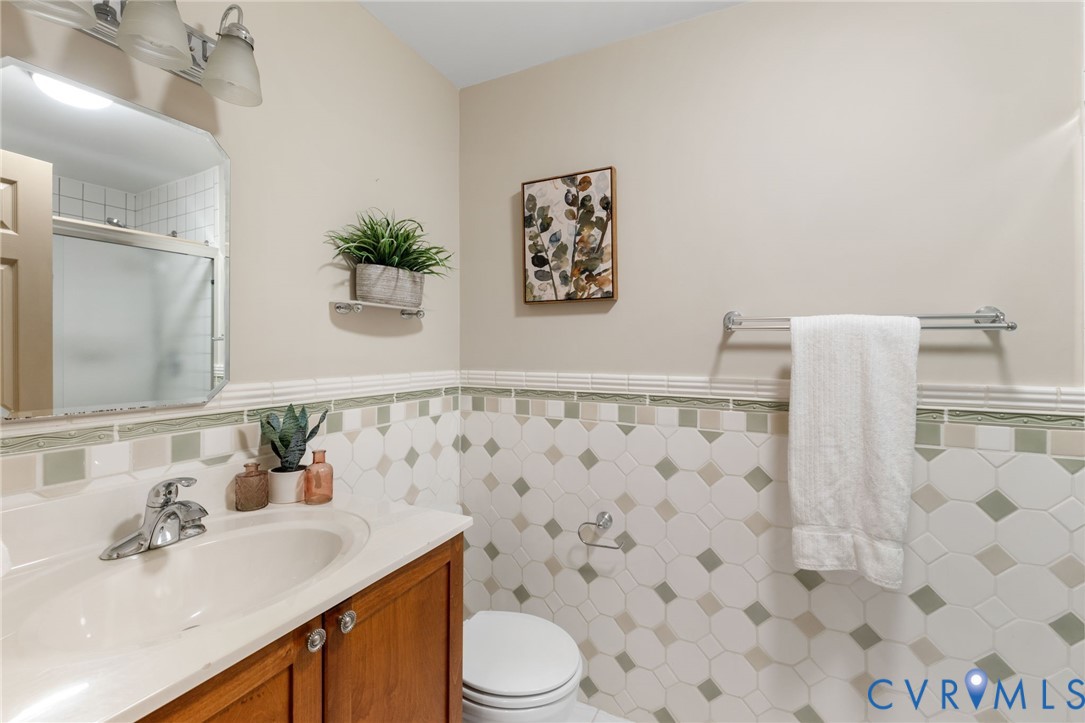 36 Dahlgren Road Richmond, VA 23238 - Photo 38 of 48 a bathroom with a sink toilet and shower