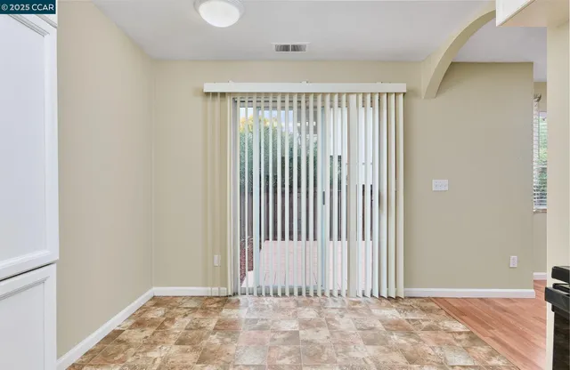 a view of a room with a wooden door