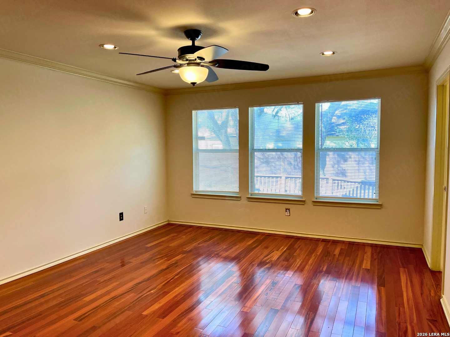 12219 Stable Rd Drive San Antonio, TX 78249 - Photo 13 of 21 a view of an empty room with wooden floor and a window