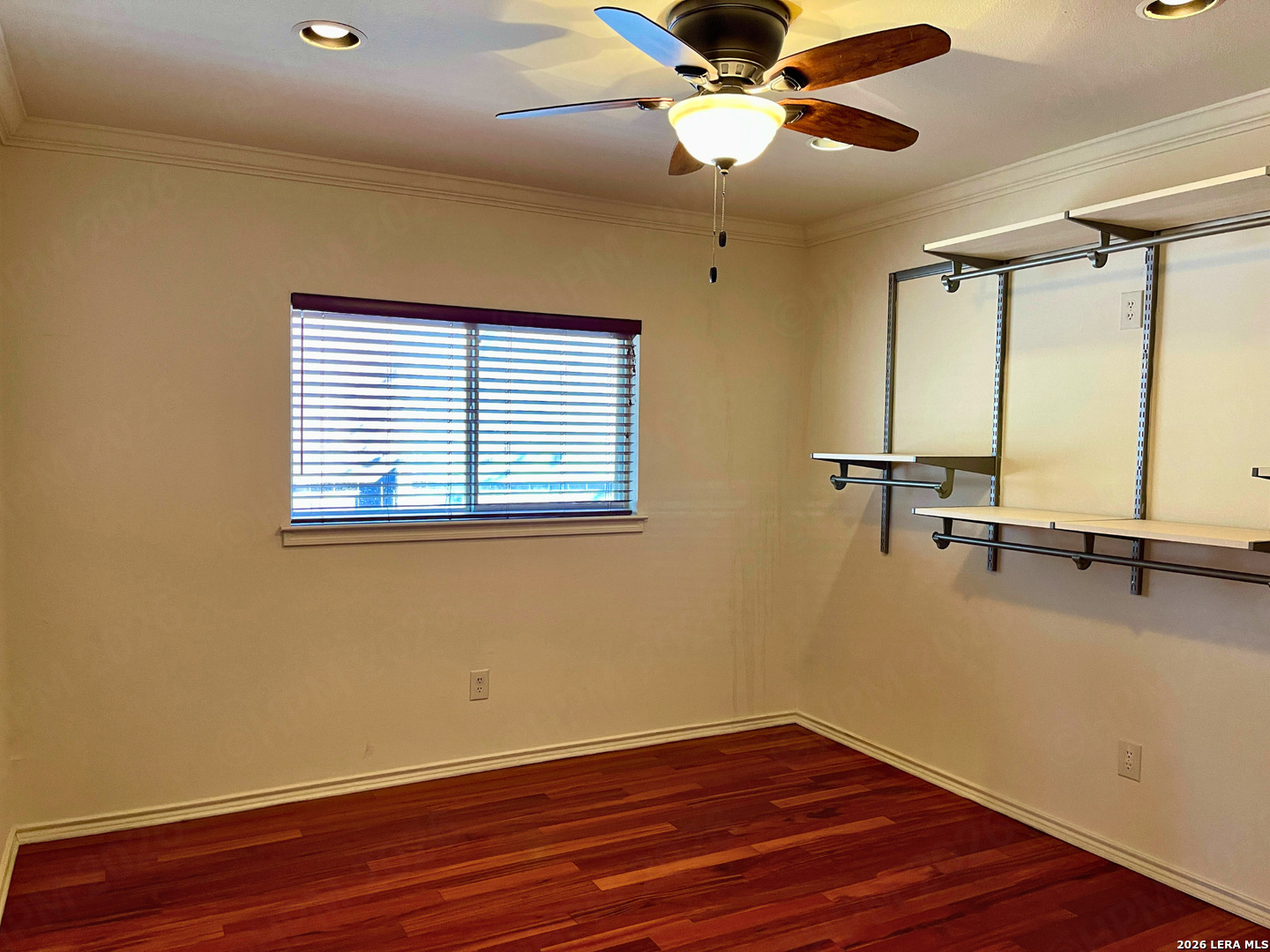 12219 Stable Rd Drive San Antonio, TX 78249 - Photo 14 of 21 a view of a room with wooden floor and fan