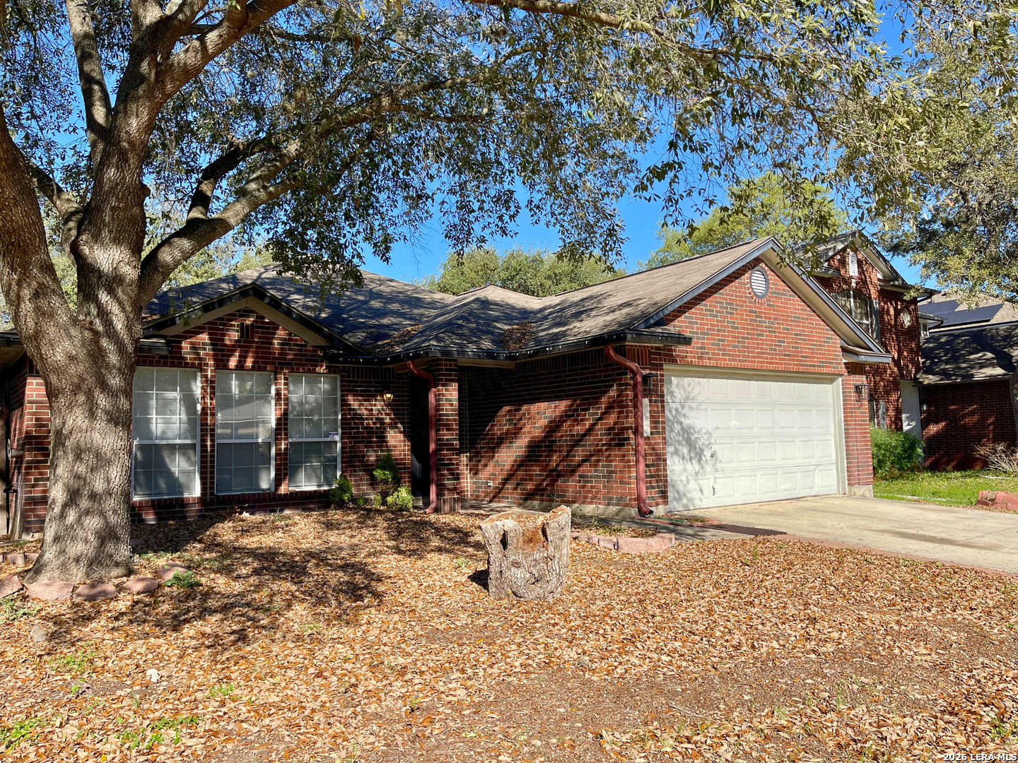 12219 Stable Rd Drive San Antonio, TX 78249 - Photo 2 of 21 a view of a house with a snow in the yard