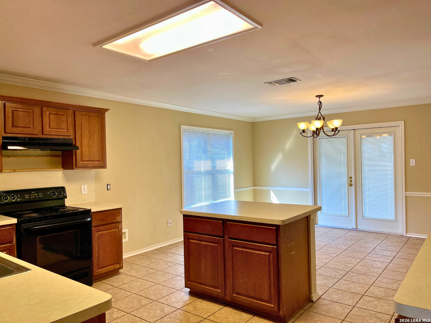 12219 Stable Rd Drive San Antonio, TX 78249 - Photo 10 of 21 a kitchen with granite countertop a sink and a stove