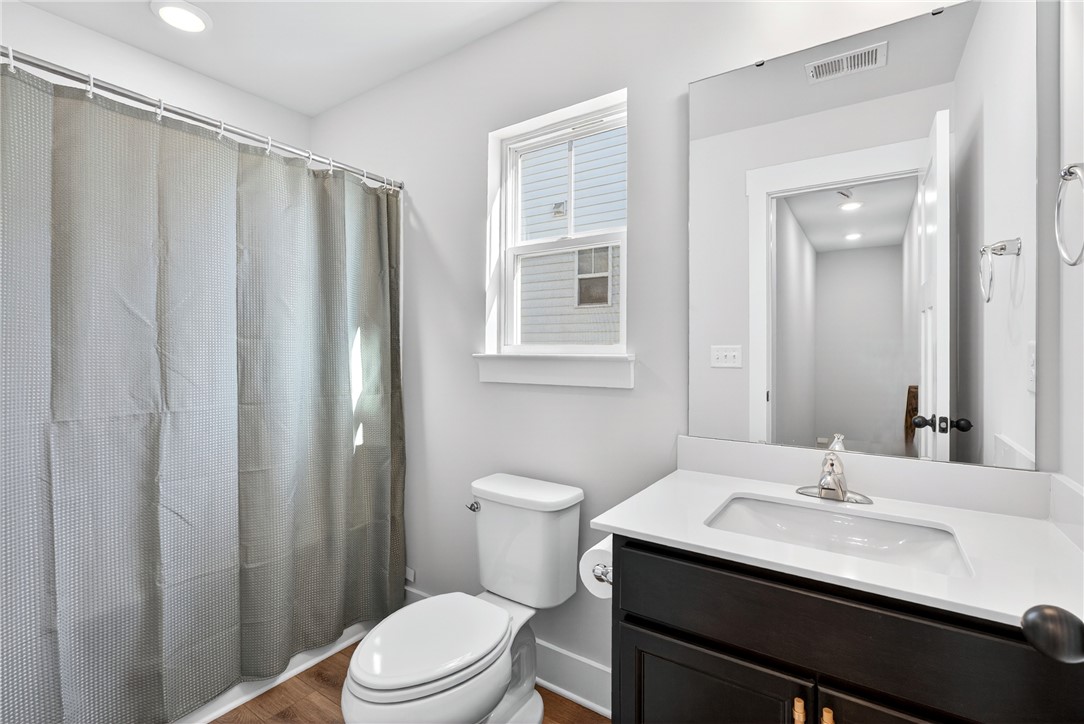 128 Whitman Way Easley, SC 29642 - Photo 13 of 34 This bright bathroom features a spacious vanity and a convenient window.