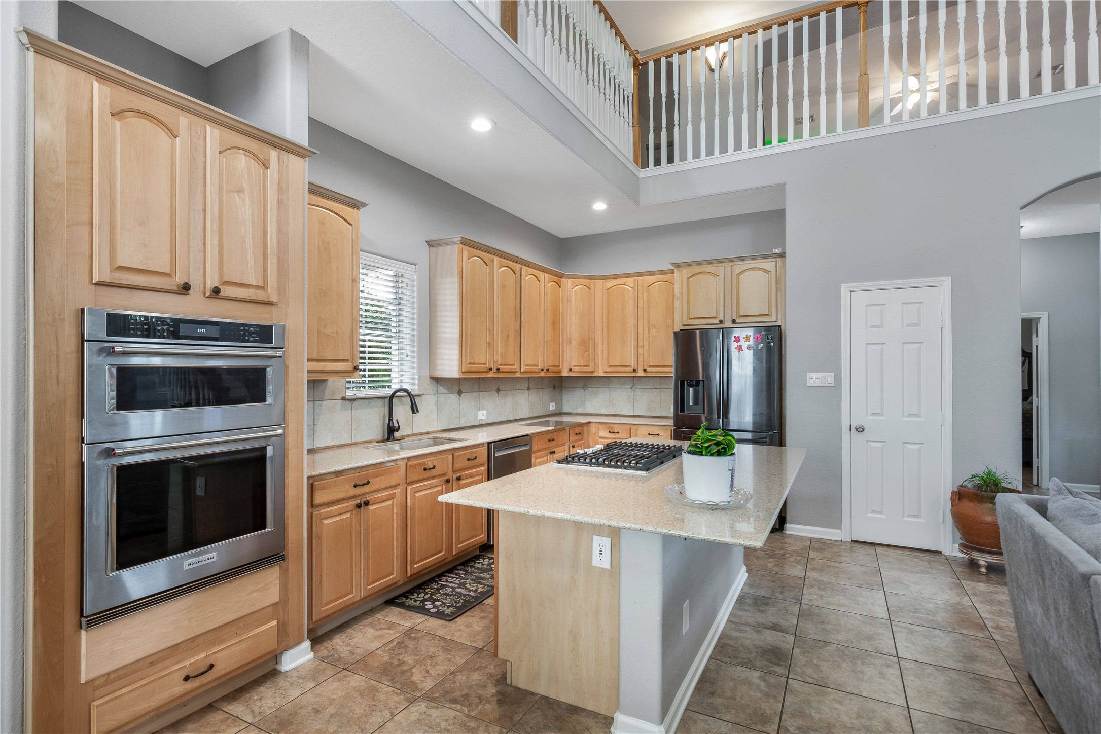 13914 Skinner Road Cypress, TX 77429 - Photo 29 of 50 Mother In Law Suite: Spacious kitchen with granite countertops, a center island, double ovens, plenty of cabinet space, and an open view into the living area.