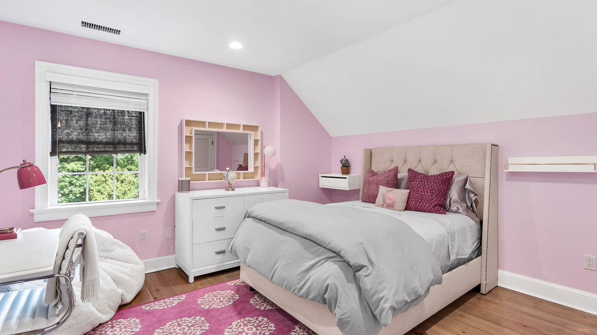 3 Exeter Lane Wainscott, NY 11975 - Photo 13 of 17 a bed room with a bed and a large window