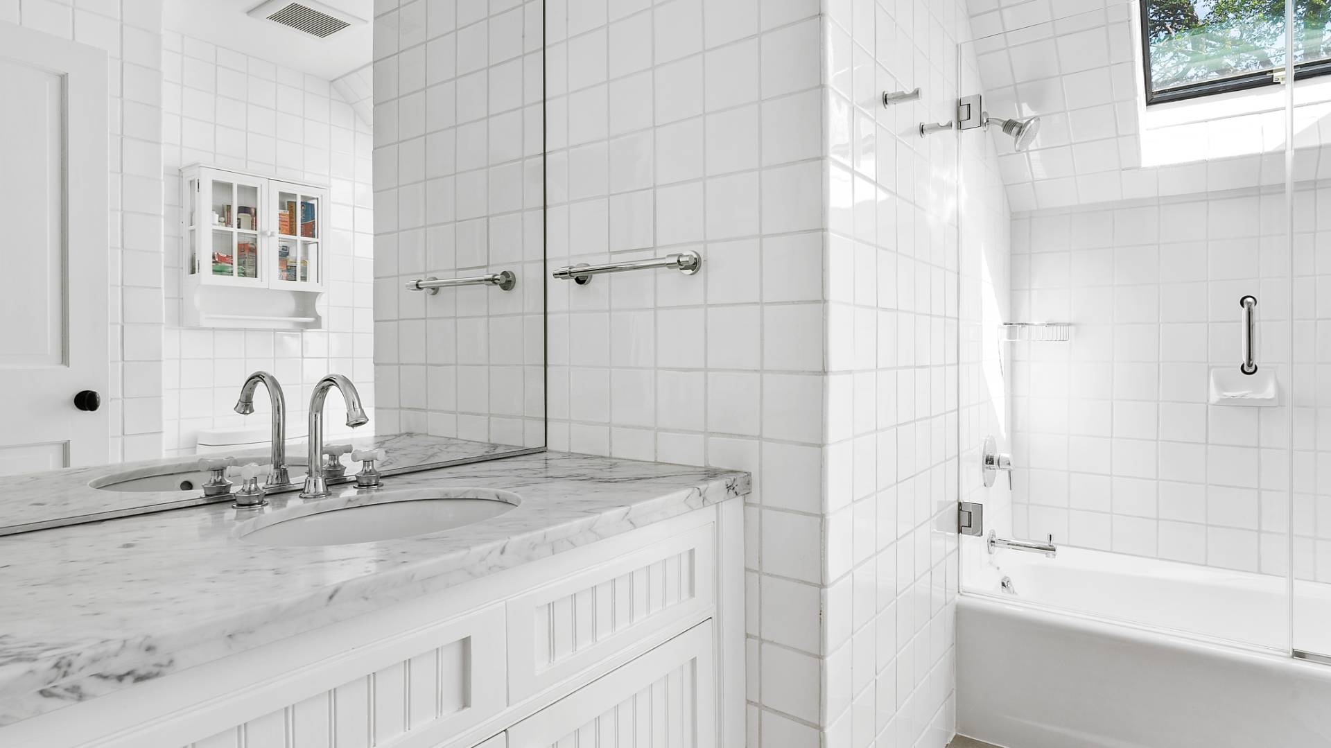 3 Exeter Lane Wainscott, NY 11975 - Photo 14 of 17 a bathroom with a granite countertop sink a mirror and a bathtub