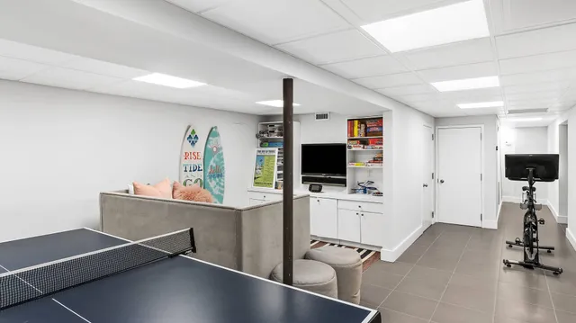 a view of a livingroom with furniture and a flat screen tv