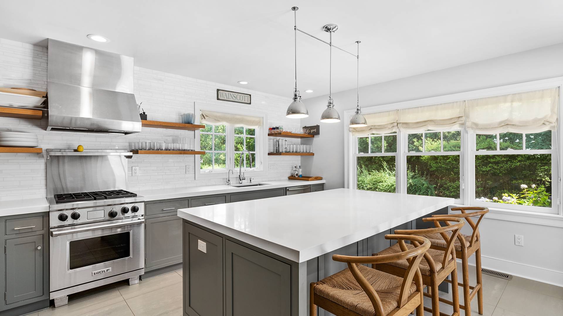 3 Exeter Lane Wainscott, NY 11975 - Photo 4 of 17 a kitchen with a stove a sink and a wooden floor