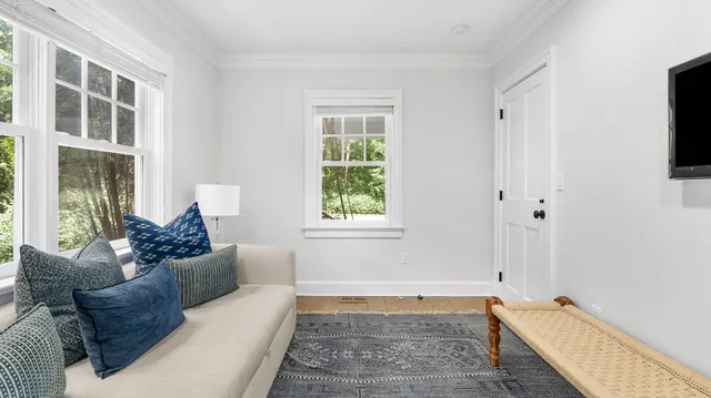 a living room with furniture and a window