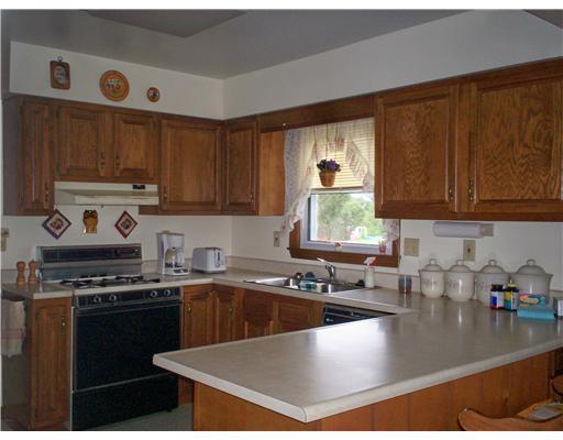 41 Kaufman Road Gibsonia, PA 15044 - Photo 4 of 11 Kitchen. Solid wood cabinets, pantry and counter divider. Refrigerator, gas range, dishwasher and disposal all stay.