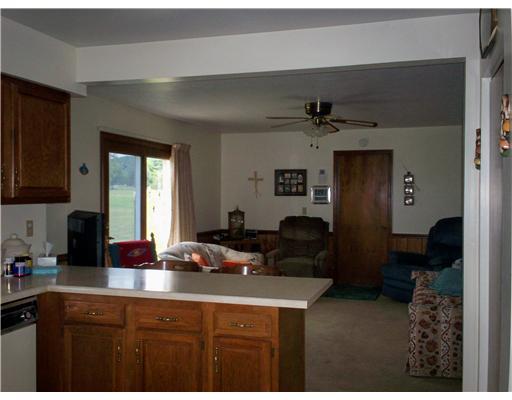 41 Kaufman Road Gibsonia, PA 15044 - Photo 5 of 11 Family Room. Beige carpeting & walls and ceiling fan. Laundry and garage access. Washer and dryer included.