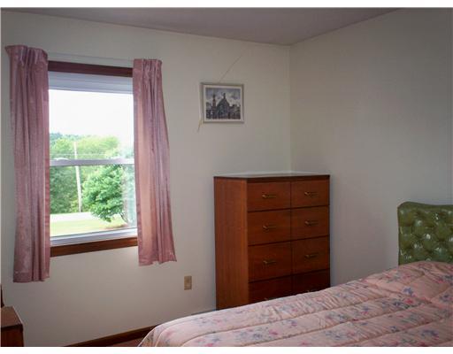 41 Kaufman Road Gibsonia, PA 15044 - Photo 8 of 11 Bedroom. Neutral walls and rose carpeting, window and closet. Attic access is in the hall.