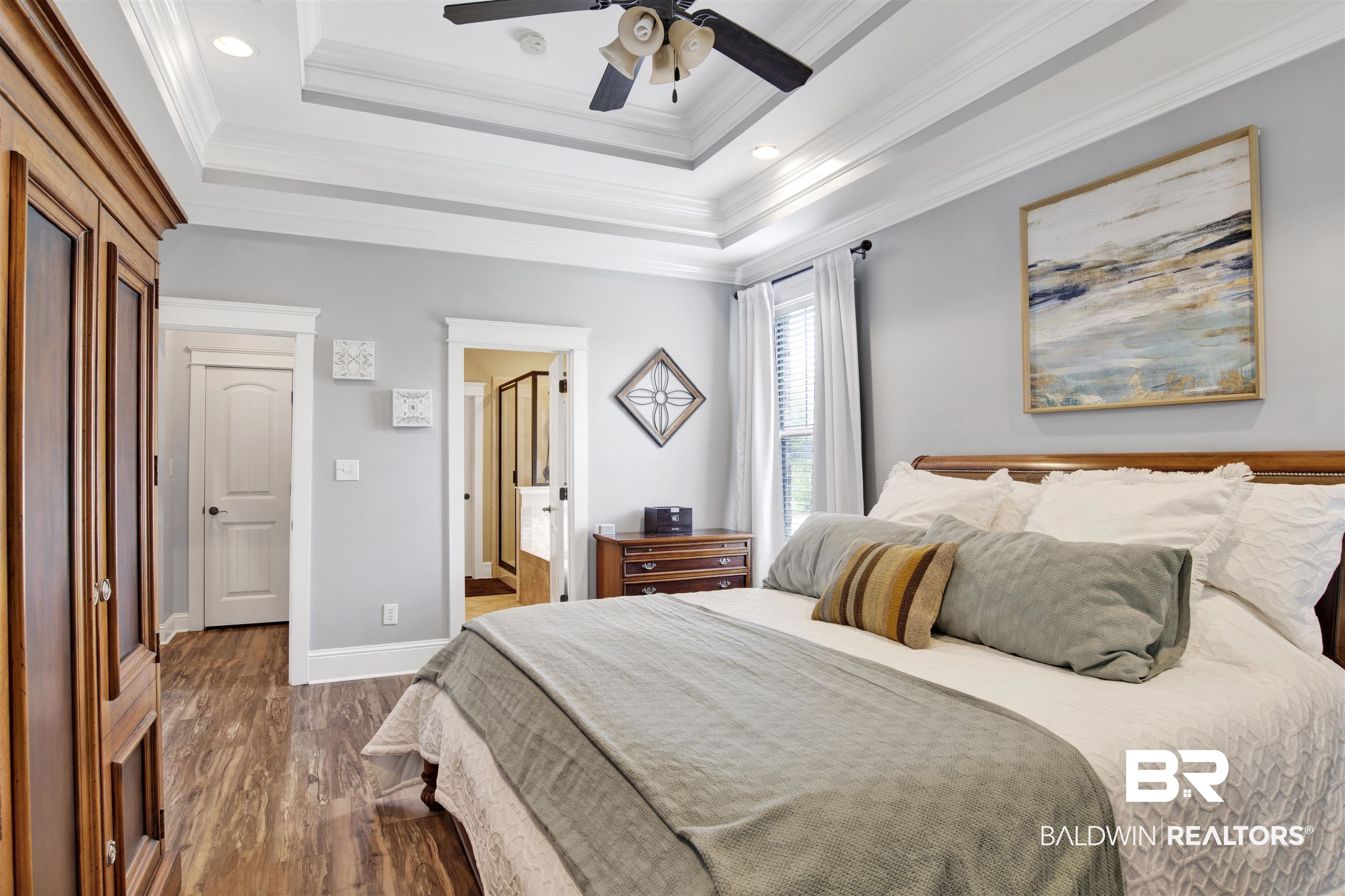 12418 Cambron Trail Daphne, AL 36527 - Photo 35 of 44 Bedroom with ceiling fan, dark hardwood / wood-style floors, a raised ceiling, and crown molding