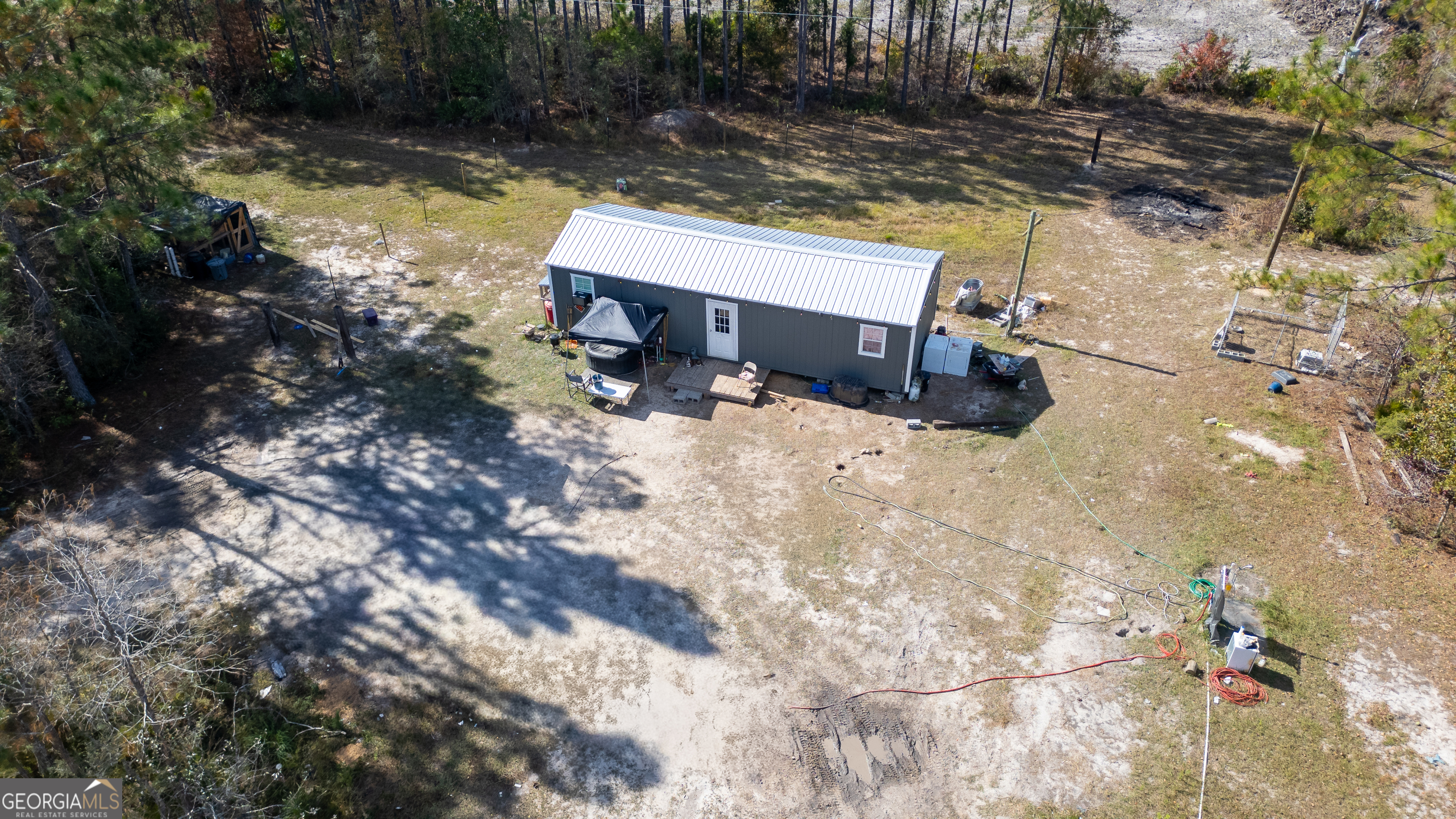 3222 Bertran Trail Waycross, GA 31503 - Photo 5 of 10 a view of a backyard with sitting area