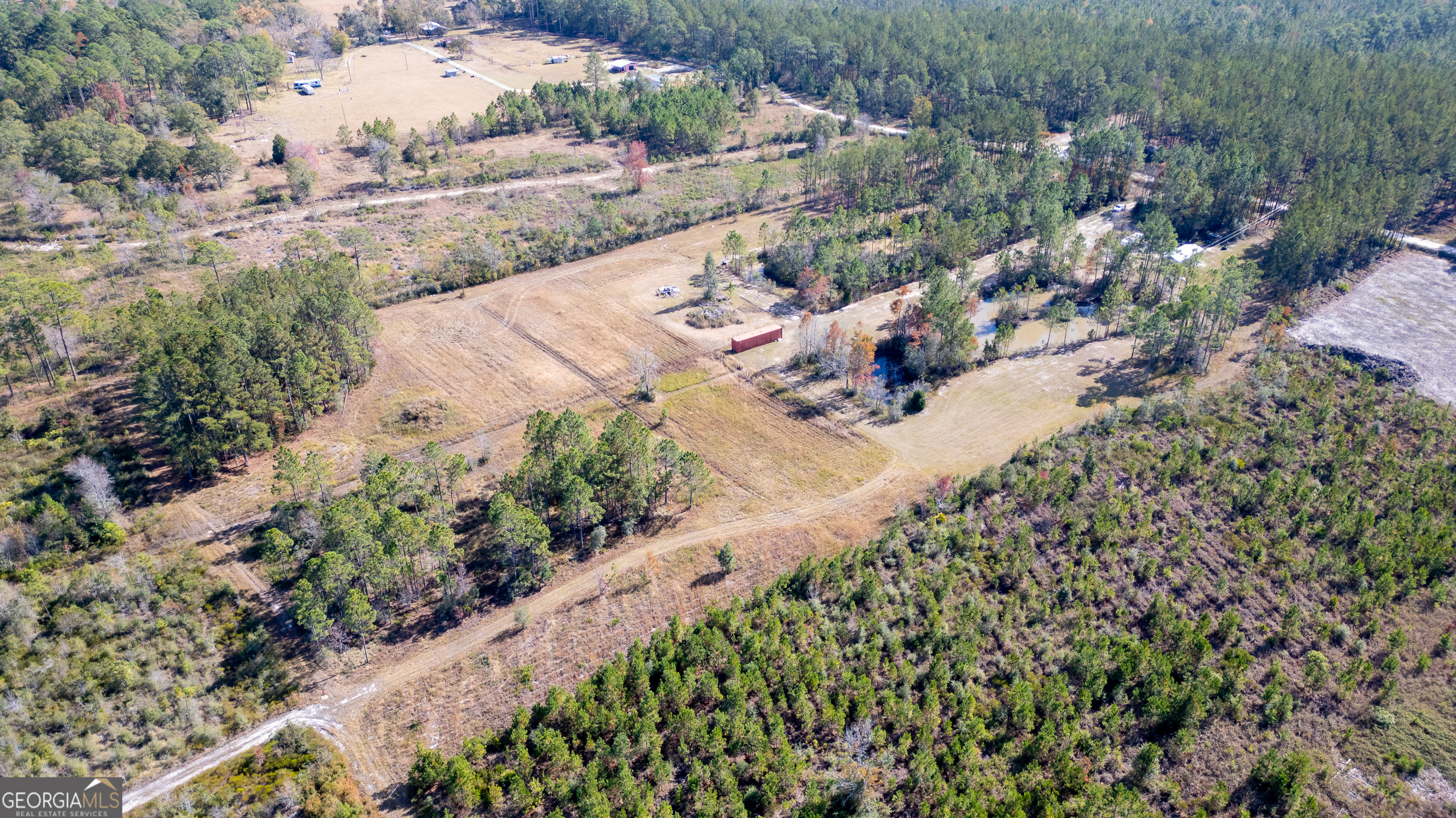 3222 Bertran Trail Waycross, GA 31503 - Photo 9 of 10 an aerial view of a house with a yard