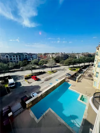 a view of swimming pool with lounge chair
