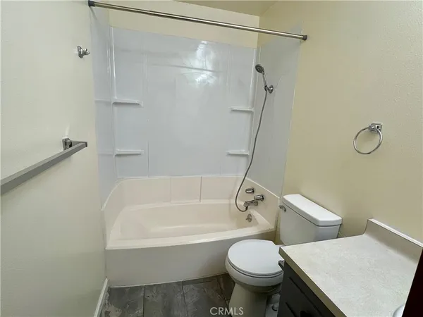 a bathroom with a sink a toilet and a bathtub